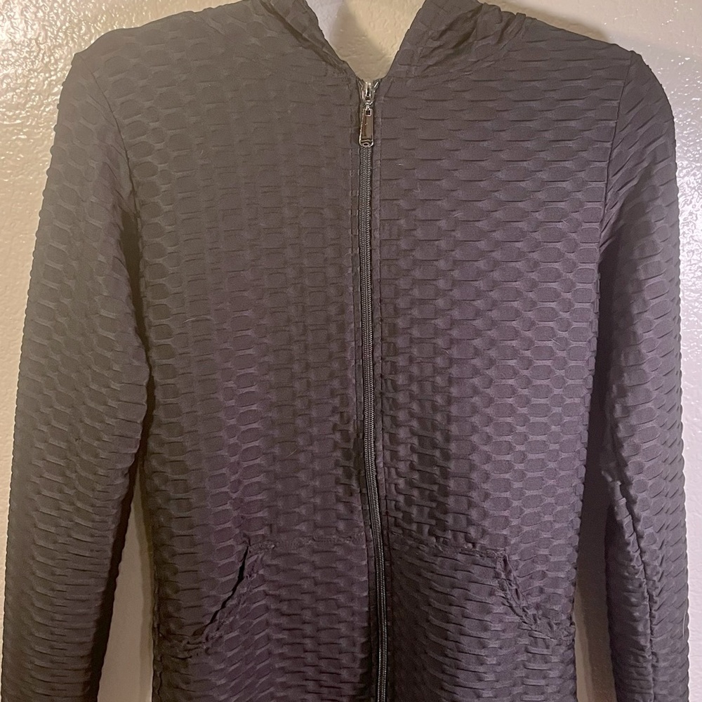 Women’s black light jacket.